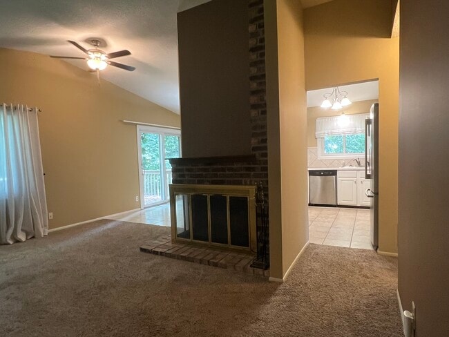 Living room with vaulted ceiling - 6811 Balsam Ln N