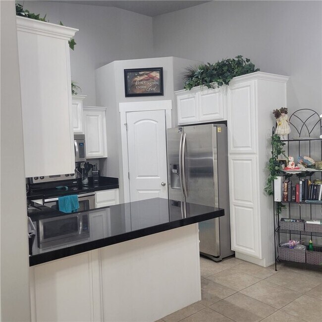 Kitchen with island, extra storage under the island and electrical outlet at the end of the island - 1957 N Crest Rd