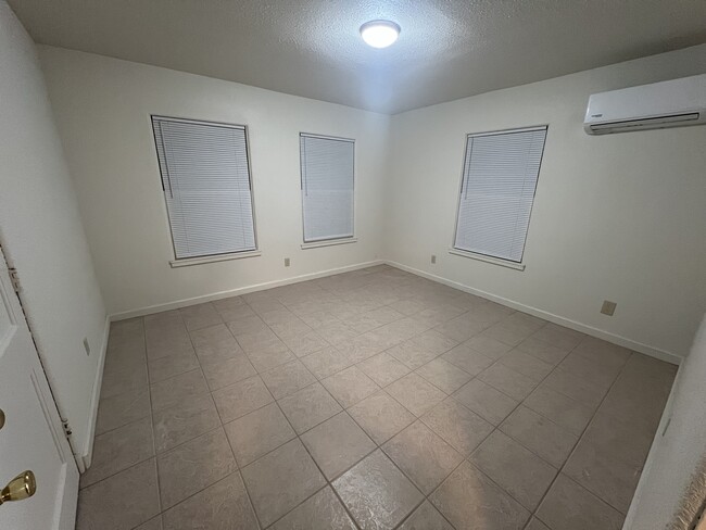 One bedroom with storage closet (left). 11’x11’. Mini split. - 217 N 1st St