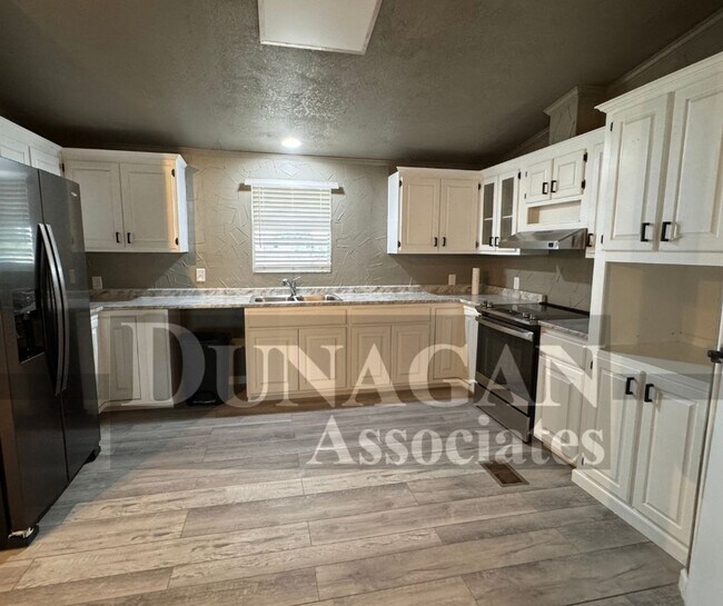 Building Photo - Remodeled!! 3 Bedroom 2 Bath with large parking area/covered parking .