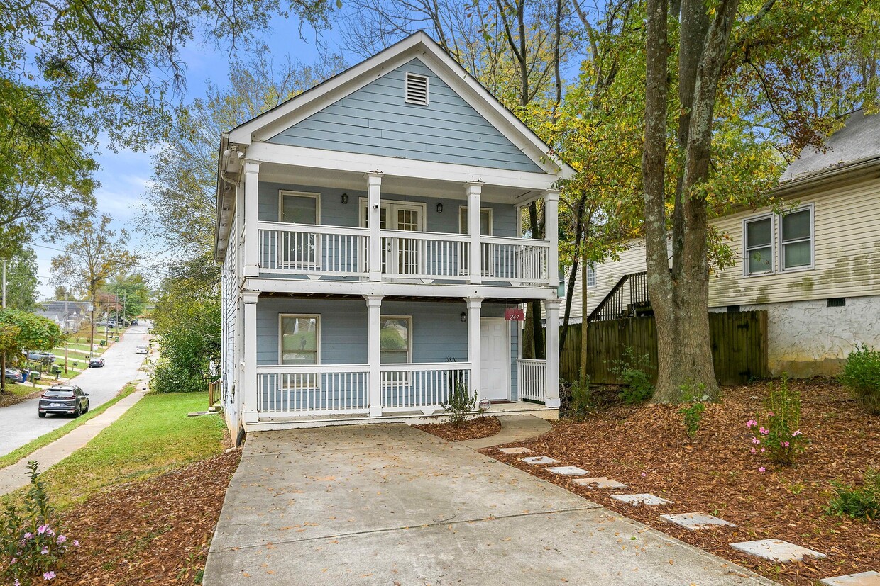 Charming exterior of the home with a welcoming entrance and well-maintained curb appeal - 247 Farrington Ave SE