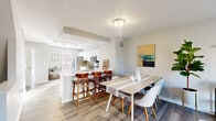 Located at 6400 Preserve Crossing Blvd N in Columbus, Ohio, this three-story townhome offers a thoughtfully designed layout across three distinct levels. The entry level provides a welcoming foyer with wood-look flooring, a closet with open shelving, and a staircase leading to the main living area.

The main floor serves as the heart of the home, featuring an open-concept kitchen and living room flooded with natural light. The kitchen is outfitted with white shaker cabinetry, a subway tile backsplash, stainless steel appliances — including a range, microwave, and dishwasher — and a peninsula with bar seating. Adjacent to the kitchen, the dining and living areas flow seamlessly together, with wood-look flooring and large windows overlooking the outdoors.

The upper level hosts both bedrooms, each carpeted and filled with natural light. The primary bedroom offers a comfortable, private retreat, while the second bedroom is equally well-sized. Three full bathrooms are distributed throughout the home, each featuring white vanities and tub-shower combinations with clean, neutral finishes.

A dedicated laundry room on the upper level includes a full-size washer and dryer with open shelving above — a practical and convenient amenity. Hallways on each floor connect the spaces efficiently, completing this functional and attractively finished townhome.