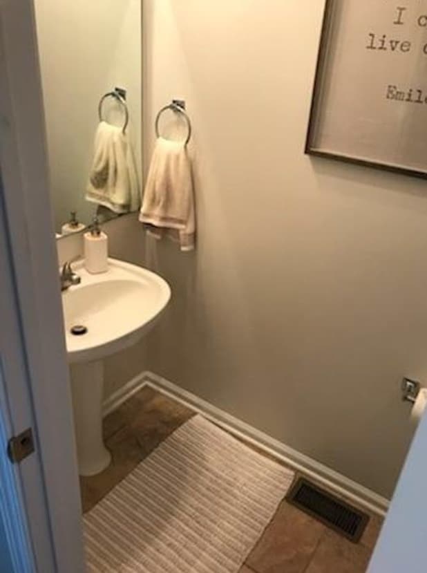 Half bath just off the living and dining area. - 231 Legacy Lane