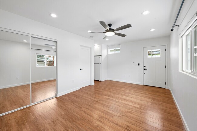 Bathroom door is closed on the left and kitchen in the middle - 618 S Citron St