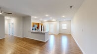 Located at 6803 Myrrh Circle in Louisville, KY, this well-appointed 3-bedroom, 2-bathroom residence offers a thoughtfully designed single-level layout with generous living space throughout. The open-concept kitchen and living room serve as the heart of the home, featuring warm wood-toned cabinetry, granite-style countertops, a peninsula with a sink, and a full suite of stainless steel appliances including a refrigerator, range, and microwave. Recessed lighting and hardwood-style flooring extend throughout the main living areas, creating a bright and cohesive atmosphere. French doors lead to a private balcony, allowing natural light to flood the kitchen and dining area. The spacious primary bedroom includes hardwood-style flooring and a ceiling fan, while the additional bedrooms are finished with plush carpeting and feature windows that bring in natural light. Each bedroom is complemented by dedicated closet space, including walk-in style closets with wire shelving. The bathrooms are finished with wood-toned vanities and full tub-shower combinations. Throughout the residence, neutral tones, clean lines, and consistent finishes contribute to a polished, move-in-ready environment.