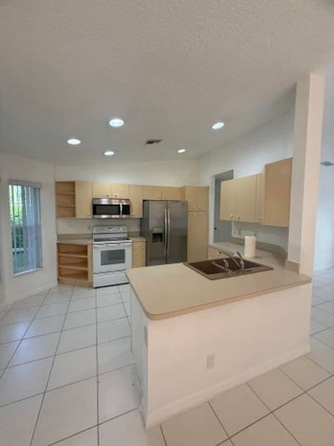 Photo - 100 Cocoplum Circle, Royal Palm Beach, FL 33411 - 4734 House