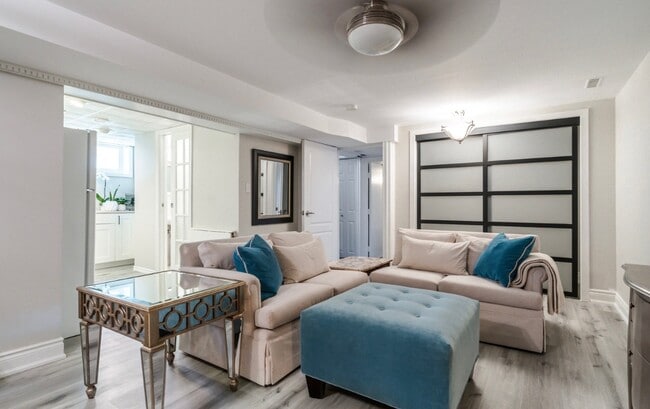 View to the sitting area, entrance to kitchen & pocket french door to bathroom - 807 Cranston Crt