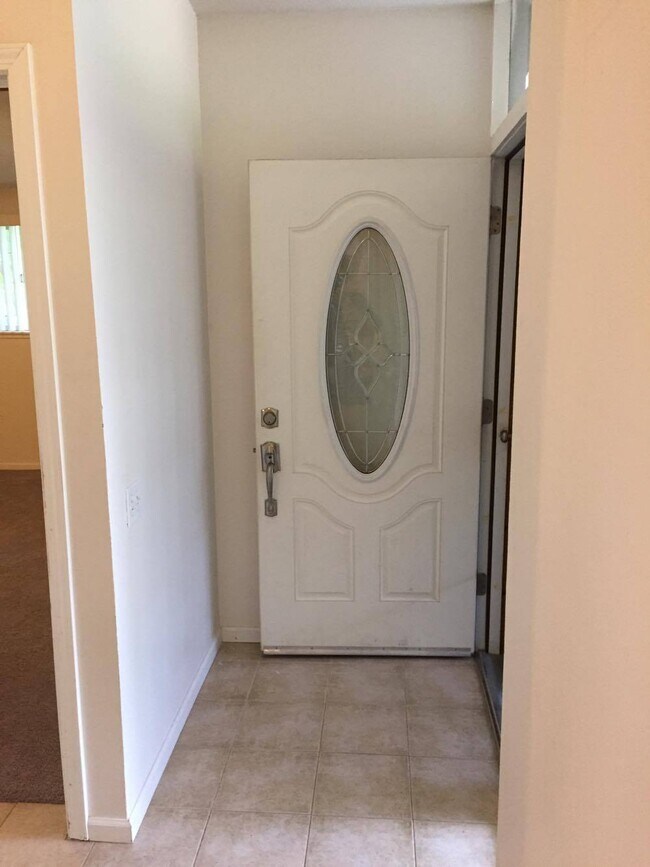 Front door from inside hallway. - 4401 Baron Ave