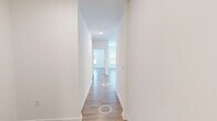 Located at 4001 Triangle Oaks Dr in Raleigh, NC, this well-designed single-story, 3-bedroom, 2-bathroom home offers a bright and cohesive living experience. Light wood-tone flooring runs throughout, tying the spaces together with a clean, contemporary feel. A wide hallway leads into the open-concept main living area, where large windows flood the space with natural light and views of the outdoors. The kitchen is a standout feature, boasting white shaker cabinetry, granite countertops, stainless steel appliances, and a central island with a built-in sink accented by stylish pendant lighting — all flowing seamlessly into the living room. The living area is generously proportioned, with a ceiling fan and dual windows that enhance the airy atmosphere. Each bedroom continues the light flooring and neutral palette, with ceiling fans, ample natural light, and dedicated closets. The spacious primary bedroom includes a walk-in closet outfitted with wire shelving. Additional closets throughout provide practical storage solutions. The bathrooms feature white cabinetry, granite-topped vanities, and tub-shower combinations, maintaining the home's consistent, modern aesthetic. Throughout, the design emphasizes clean lines, natural light, and functional layout.