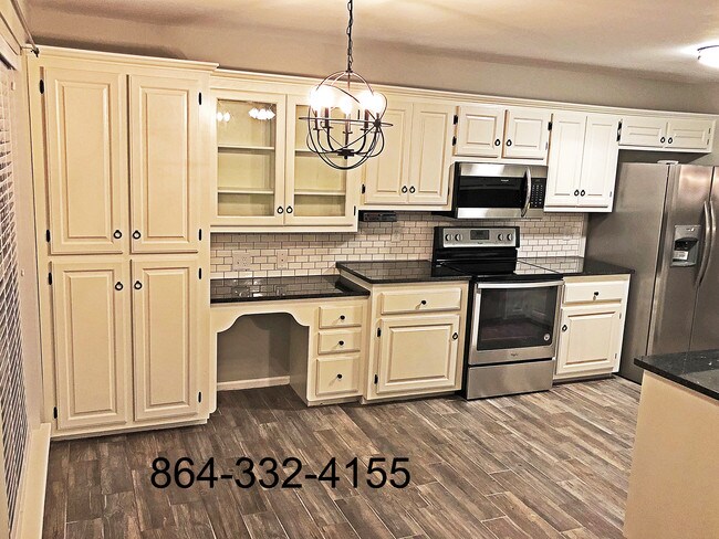 Lots of storage and a desk space in this modern kitchen - 601 Savannah Ct