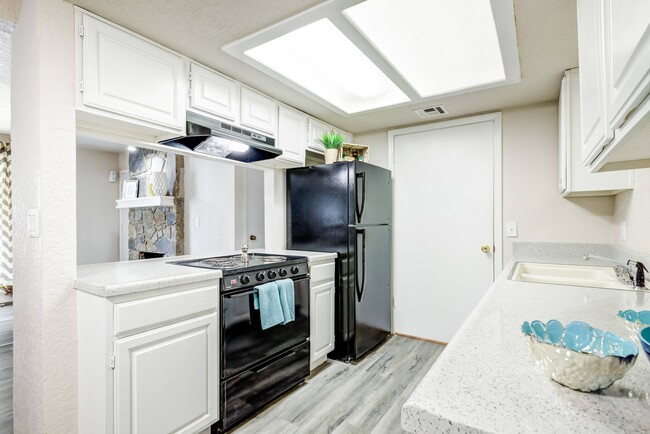 Bright Kitchen with Upgraded Appliances - Windrush Apartments