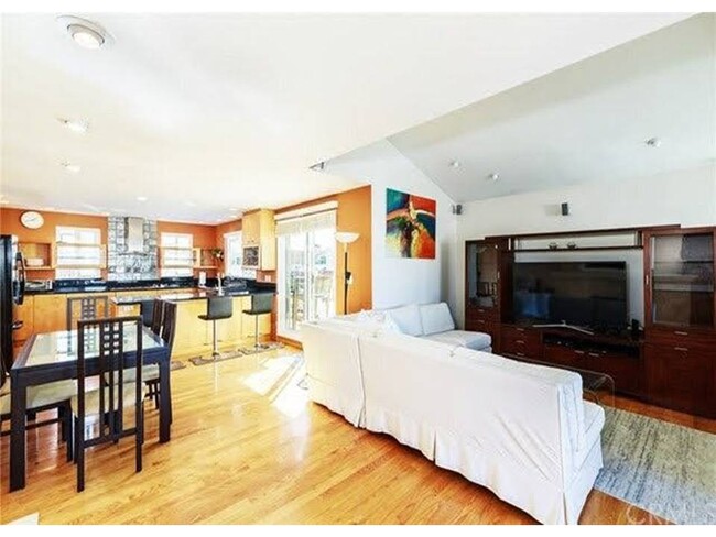 Open floor plan – kitchen, living and dining room which flows on to two balconies with ocean views - 40 7th St