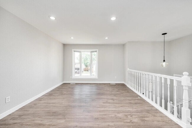 The upper living space is perfect for a sitting area to watch tv or host - 18912 E Kansas Dr