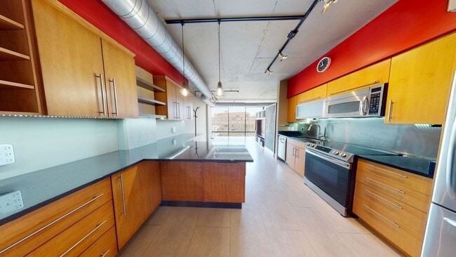 Building Photo - Modern & Sleek One Bedroom Plus Office/Den...