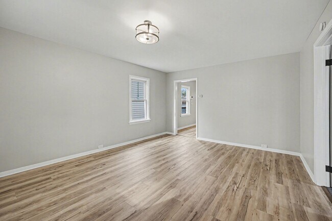 Building Photo - Updated First-Floor 2BR with Garage Parking and On-Site Laundry