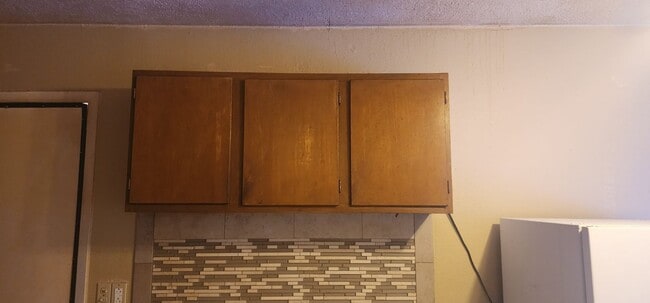 Cabinets above the stove - 5127 Temple Ct