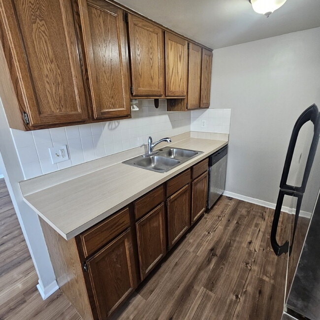 Building Photo - 2-Bedroom, 1 Bathroom Condo with New Laminate Flooring Throughout The Main Living Area, Kitchen w...