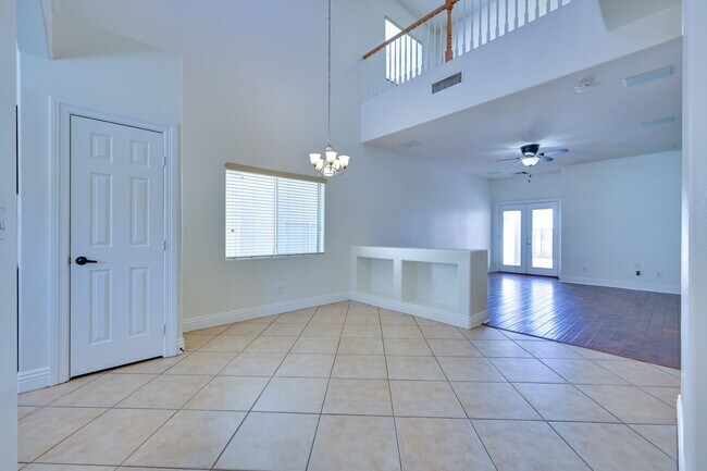 Building Photo - NW 4 Bedrooms!! Primary bed & Bath Downstairs!! Tankless Water Heater!! Low maintenance, Desert l...