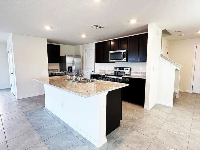 Foto del edificio - 5795 Cape Primrose Dr