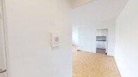 Located on the third floor at 263 Dixon Road in Toronto, this well-laid-out two-bedroom, one-bathroom unit offers a comfortable and functional living space. Warm parquet flooring runs consistently throughout the main living areas and bedrooms, giving the home a cohesive and classic character.

The open living room is generously sized, bathed in natural light through large windows that frame views of the surrounding greenery and neighbouring buildings. A baseboard heating system lines the window walls, ensuring year-round comfort. The kitchen is accessed via a dedicated passageway from the living room and features white cabinetry, a subway tile backsplash, a white electric range, and durable tile flooring — a practical and tidy workspace.

The primary bedroom is notably spacious and includes a walk-in closet with built-in shelving, offering excellent storage. The second bedroom is a comfortable size, also with parquet flooring and a bright window with outdoor views. A hallway connects all rooms efficiently, contributing to the unit's logical and easy-to-navigate layout.

The bathroom is finished with clean white subway tile surrounding a full soaker tub with overhead shower, maintaining a bright and functional aesthetic throughout. Overall, the unit presents a clean, neutral palette ideal for a variety of living arrangements.