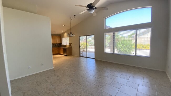 Living room/dining area with preview into kitchen - 6806 W Quail Ave