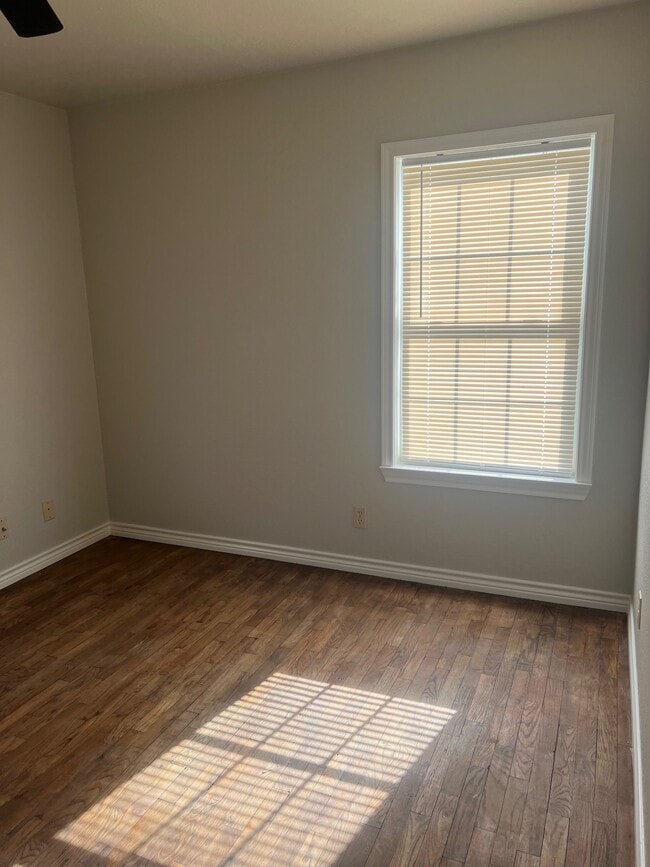 Bedroom 1 - all wood floors throughout house. - 2686 FM 1198