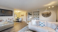 Located at 874 Yorkchester Rd in Houston, TX, this thoughtfully designed 2-bedroom, 2-bathroom home offers a comfortable and cohesive living experience across a single floor. The entryway welcomes visitors with large windows that flood the space with natural light, warm wood-look flooring, and a welcoming ambiance that carries throughout the home.

The living room is a standout feature, boasting built-in display shelving with glass shelves, wood-look flooring, and a bright, open feel. It flows seamlessly into the dedicated dining area, which features a modern light fixture and the same warm flooring, creating an ideal setting for entertaining.

The galley-style kitchen is efficiently designed with white cabinetry, light quartz countertops, stainless steel appliances including a refrigerator and dishwasher, and ample storage.

The spacious primary bedroom is carpeted for comfort and includes a ceiling fan, natural light from a sliding glass door, and access to a generously sized walk-in closet with multi-tiered shelving. The second bedroom is equally comfortable with carpeted floors and a ceiling fan. Both bathrooms feature tub-shower combinations, white cabinetry, and wood-look flooring. The neutral tones and clean finishes throughout create a bright, inviting atmosphere.