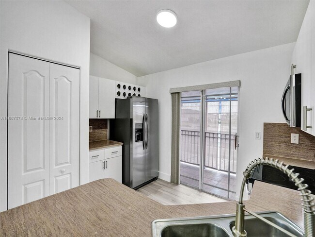 Building Photo - 11001 W Okeechobee Road 201, Hialeah Garde...