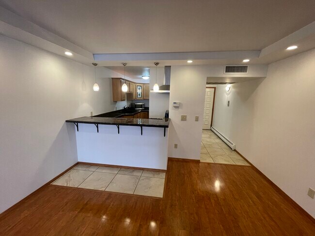 View of kitchen from LR - 4155 W Rivers Edge Cir