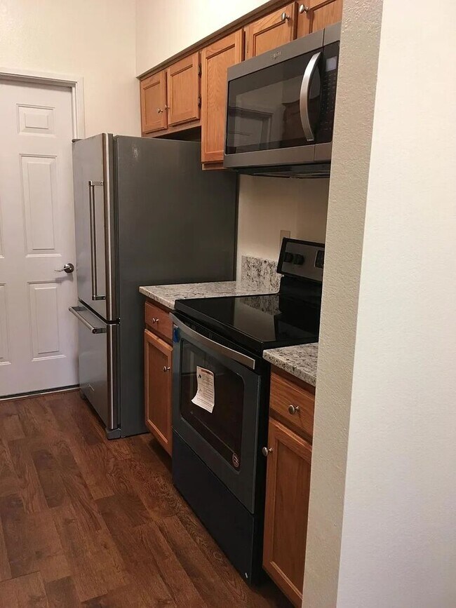 Building Photo - 2BR Condo With Attached Garage Available F...