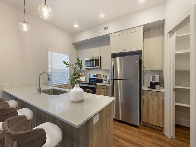 Modern Kitchen with a Large Pantry - Desert Sage Townhomes