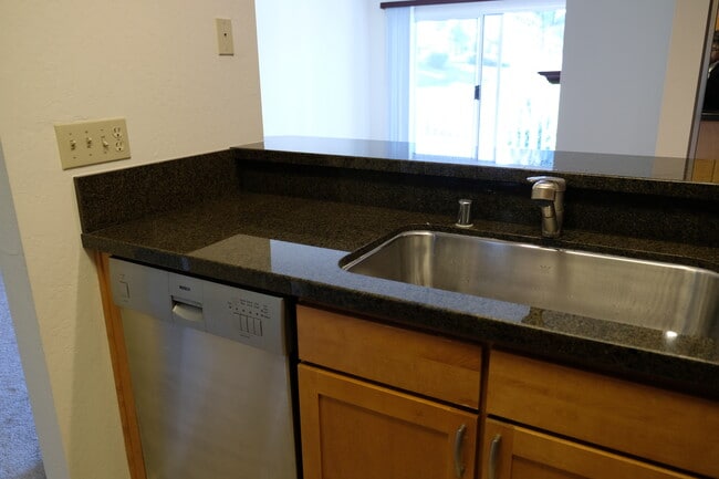 Kitchen has view of living room and dining area - 300 Murchison Dr, #202