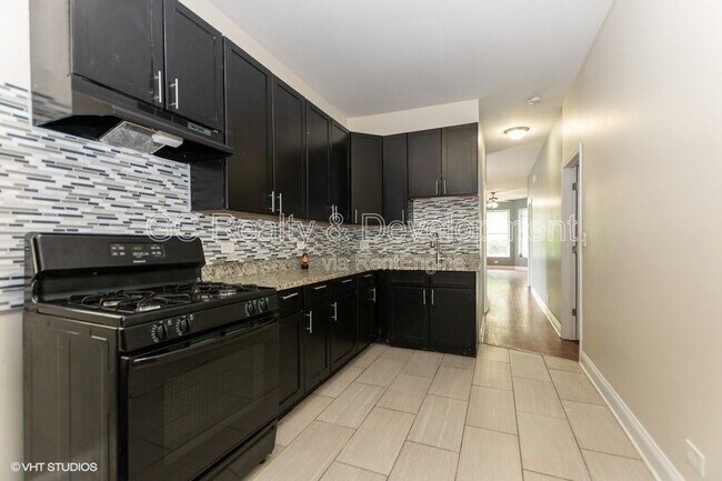 Foto del edificio - 7642 S Normal Ave