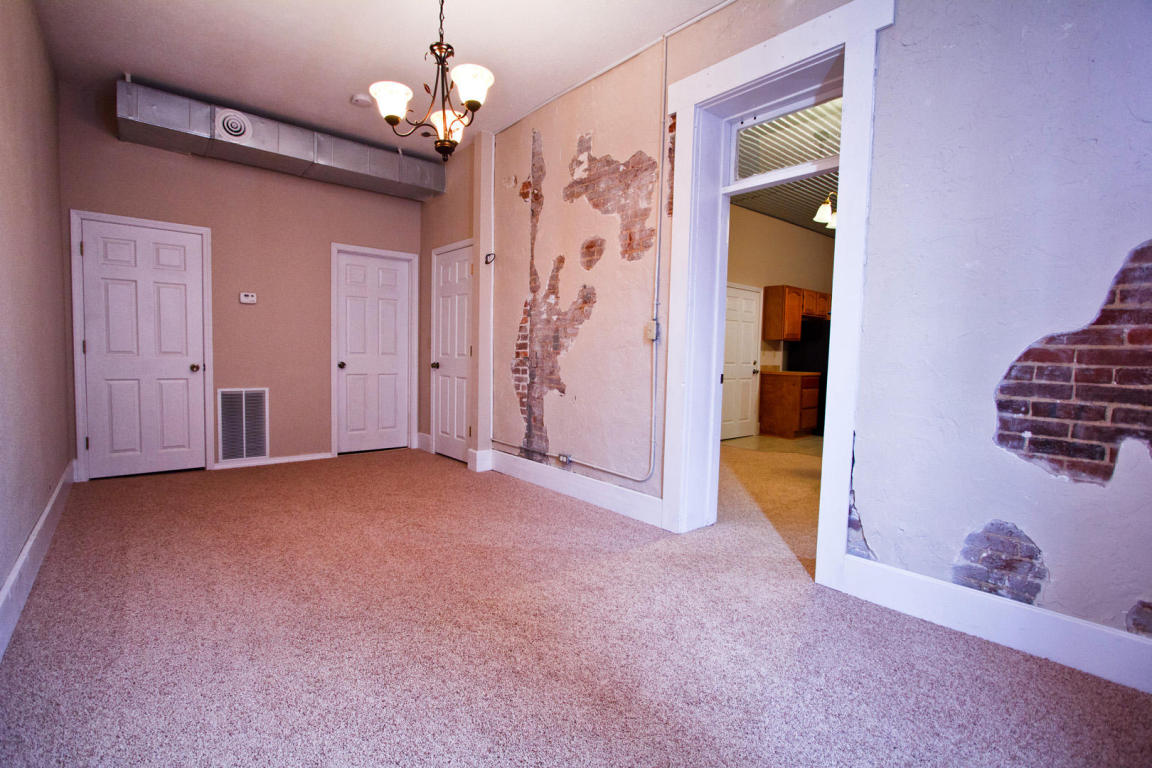 Beautifully Exposed Historic Brick Bedroom - 101 N Market Ave