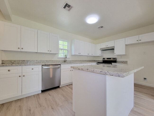Building Photo - REMODELED 4 BEDROOM 2 BATH LEASE HOME IN A...
