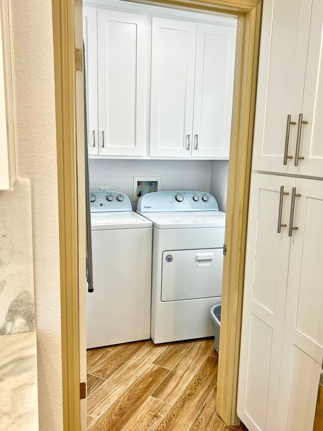 Building Photo - Steps to the beach from this Ocean View Condo with 2 car garage