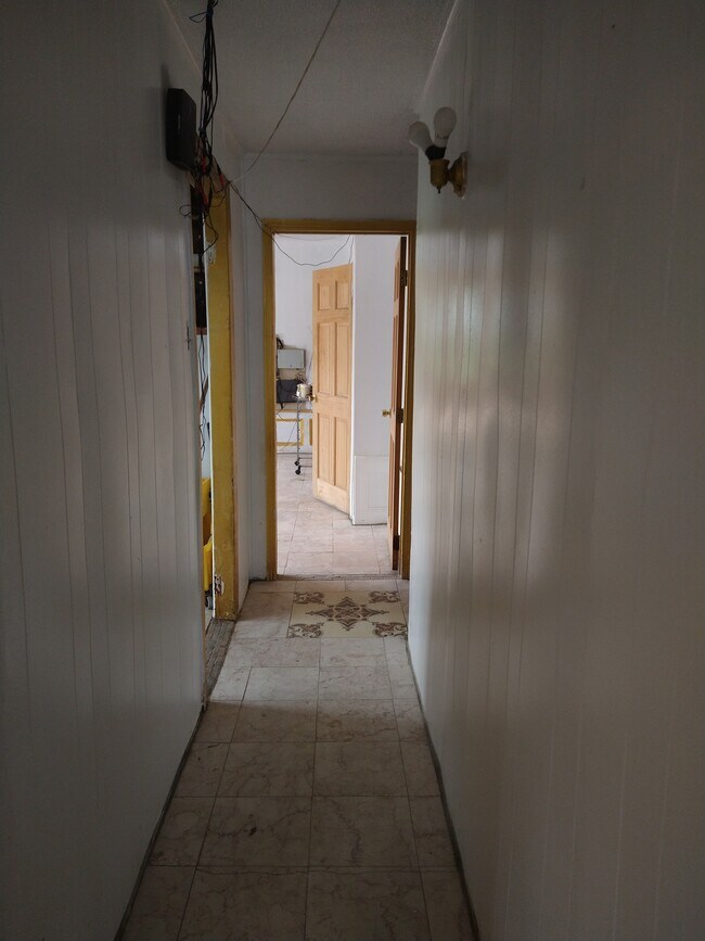 Corredor joining kitchen to bedroom and bathroom apartment 2 - 3149 93rd St