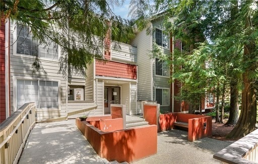 Building Photo - Lovely Condo in the Woods - Deck - Carport - FP - Closets - WD/DW - Fitness Center - Pools