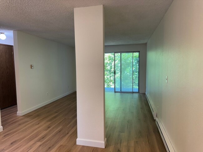 Building Photo - Charming Condo with Creek Views, Laminate ...