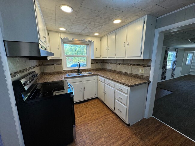 Building Photo - Updated price! Remodeled home with a large...