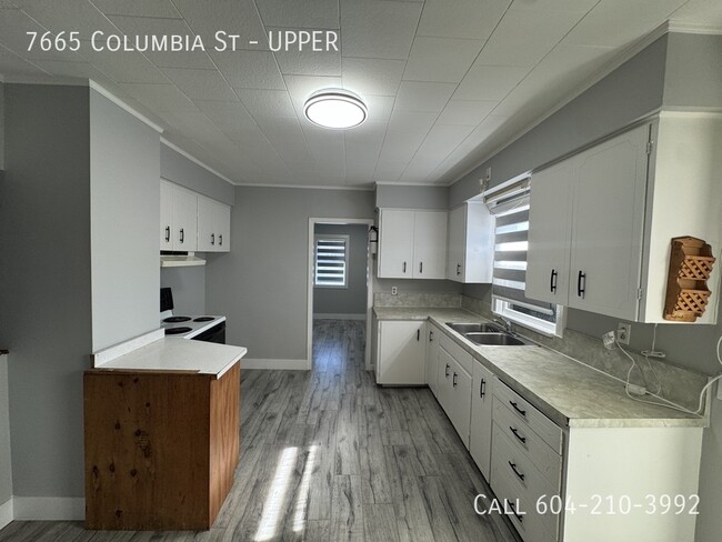 Photo du bâtiment - 2 Bedroom Upper Suite