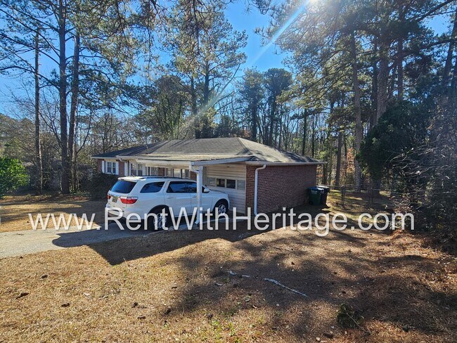 Building Photo - Great Brick Ranch / Harwood Floors / Huge Shop or Extra Storage / No Garage / Great Private Back ...