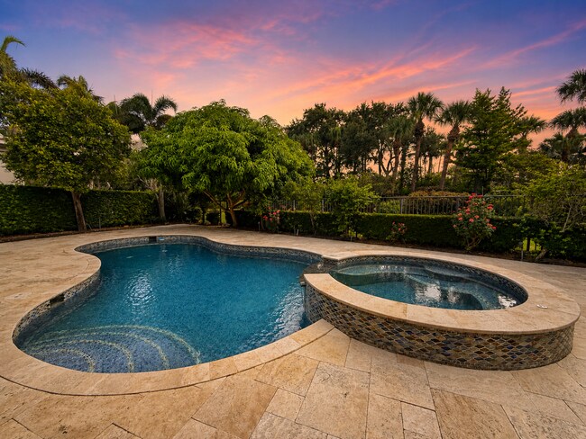Photo - "Luxurious 4-Bed Oasis with Scenic Views & Pool at 11209 Orange Hibiscus Lane!" Apartment