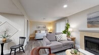 Located at 4041 Bluemel Road in San Antonio, TX, this efficiently designed one-bedroom, one-bathroom unit offers a thoughtful single-floor layout that maximizes every square foot. The open-concept living area seamlessly connects the living room, sleeping area, and kitchen, creating a cohesive and functional space. Warm wood-look flooring runs throughout, complemented by neutral-toned walls and a textured ceiling that adds character.

The living room is a standout feature, anchored by a tile-surround fireplace and accented by natural light filtering through window blinds. A stylish entryway nook with a console table and round mirror adds a welcoming touch near the front door.

The bedroom area is spacious enough to comfortably accommodate a full-sized bed and benefits from a large window with vertical blinds, along with two closets providing ample storage.

The kitchen is well-equipped with warm wood cabinetry, granite-look countertops, and a full suite of stainless steel appliances including a range, microwave, dishwasher, and refrigerator. The bathroom features a wood-toned vanity with a granite countertop, a framed mirror, and a shower-tub combination. A dedicated utility room rounds out the functional offerings of this well-appointed unit.