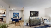 Located at 1331 Wicklow Ct in Cary, NC, this single-floor residence offers a thoughtfully designed layout with cohesive, contemporary interiors throughout. The open-concept living and dining area features wood-look flooring, a textured ceiling, and neutral walls accented with bold décor, creating a welcoming and versatile space. The living room provides ample room for seating and entertainment, while the adjacent dining area flows naturally from the main living space.

The kitchen is well-equipped with white shaker cabinetry fitted with matte black hardware, granite-look countertops, a stainless steel sink with a black faucet, a white subway tile backsplash, and stainless steel appliances, including a refrigerator and dishwasher. Wood-look flooring carries through this space seamlessly.

The residence includes multiple bedrooms, each featuring wood-look floors, large windows that invite natural light, and neutral color palettes with accent walls. The bathrooms are finished with granite-topped vanities, white cabinetry, brushed nickel fixtures, and framed mirrors. At least one bathroom includes a tiled tub-shower combination with built-in shelving. Overall, the space presents a clean, modern aesthetic with consistent finishes throughout.