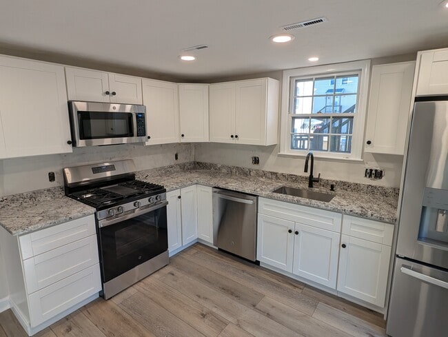 Completely remodeled kitchen with all new appliances and stone countertops. - 24 Curtis St