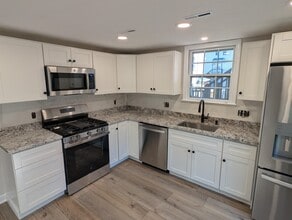 Completely remodeled kitchen with all new appliances and stone countertops. - 24 Curtis St