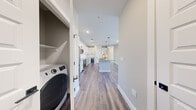 Located in the Cascade community of Bozeman, MT, this contemporary single-floor, 3-bedroom, 2-bathroom home delivers a clean, modern aesthetic throughout. The open-concept kitchen and living area serves as the heart of the home, showcasing white shaker cabinetry, a subway tile backsplash, stainless steel appliances, and a central island with quartz countertops and pendant lighting — ideal for both everyday living and entertaining. Luxury vinyl plank flooring flows seamlessly throughout the home, complementing the neutral warm-gray palette on every wall. The spacious primary bedroom offers generous proportions and is served by a well-appointed bathroom featuring a backlit LED vanity mirror, quartz countertop, white cabinetry with matte black hardware, and an undermount sink. The two additional bedrooms each feature large windows that frame expansive views of Montana's open landscape, filling the rooms with abundant natural light. A dedicated laundry closet with in-unit washer provides added convenience. An outdoor balcony extends the living space and offers open views of the surrounding Bozeman terrain under wide Montana skies. With four closets providing ample storage, this home is as functional as it is stylish.