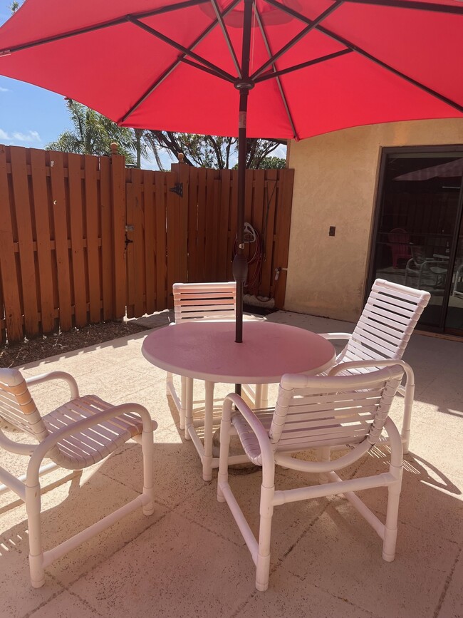 Fenced in patio with furniture included - 5830 SE Windsong Ln