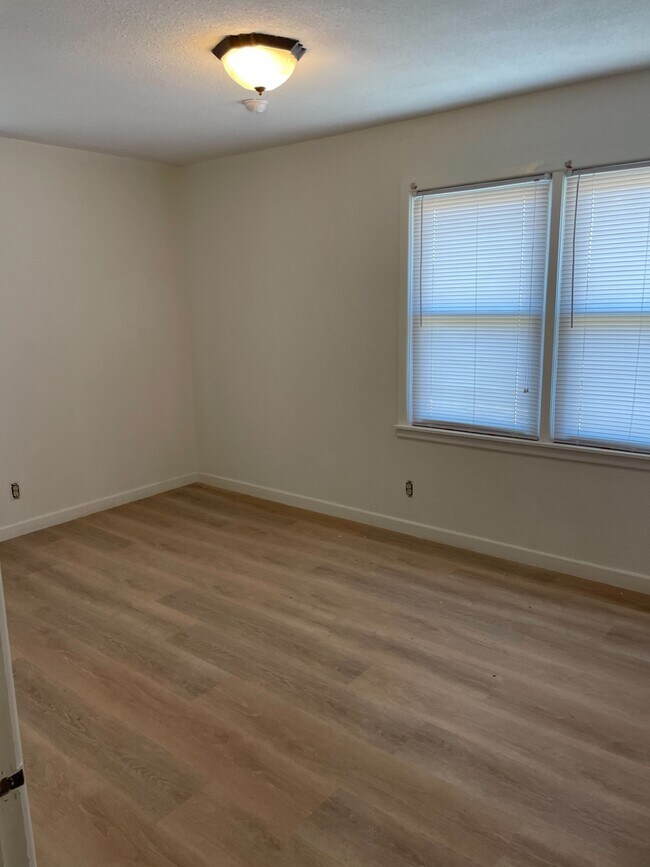 Bedroom 1 LVP flooring and new windows - 1001 NW 4th St